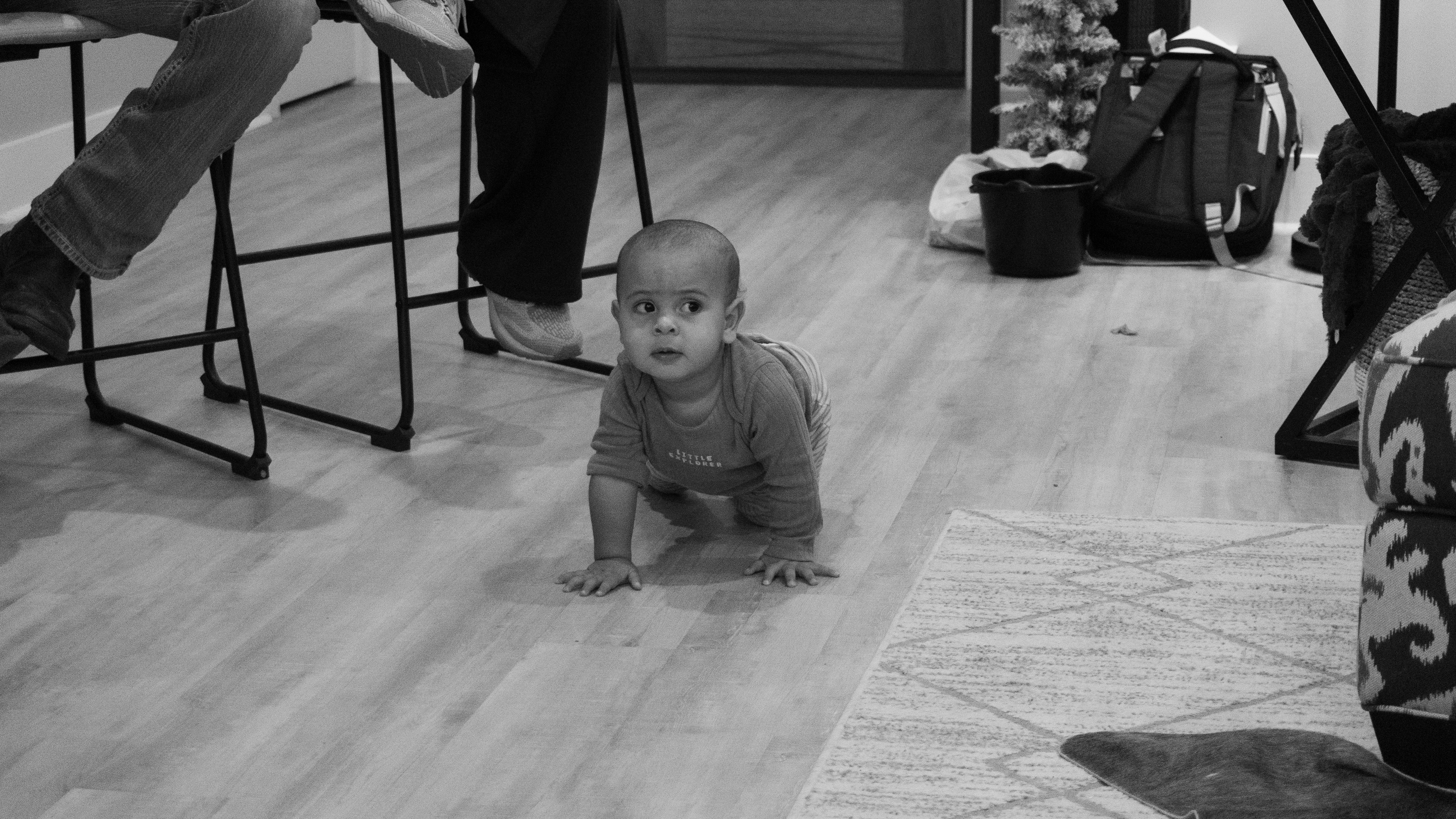 Turner crawls across the floor during group discussion.
