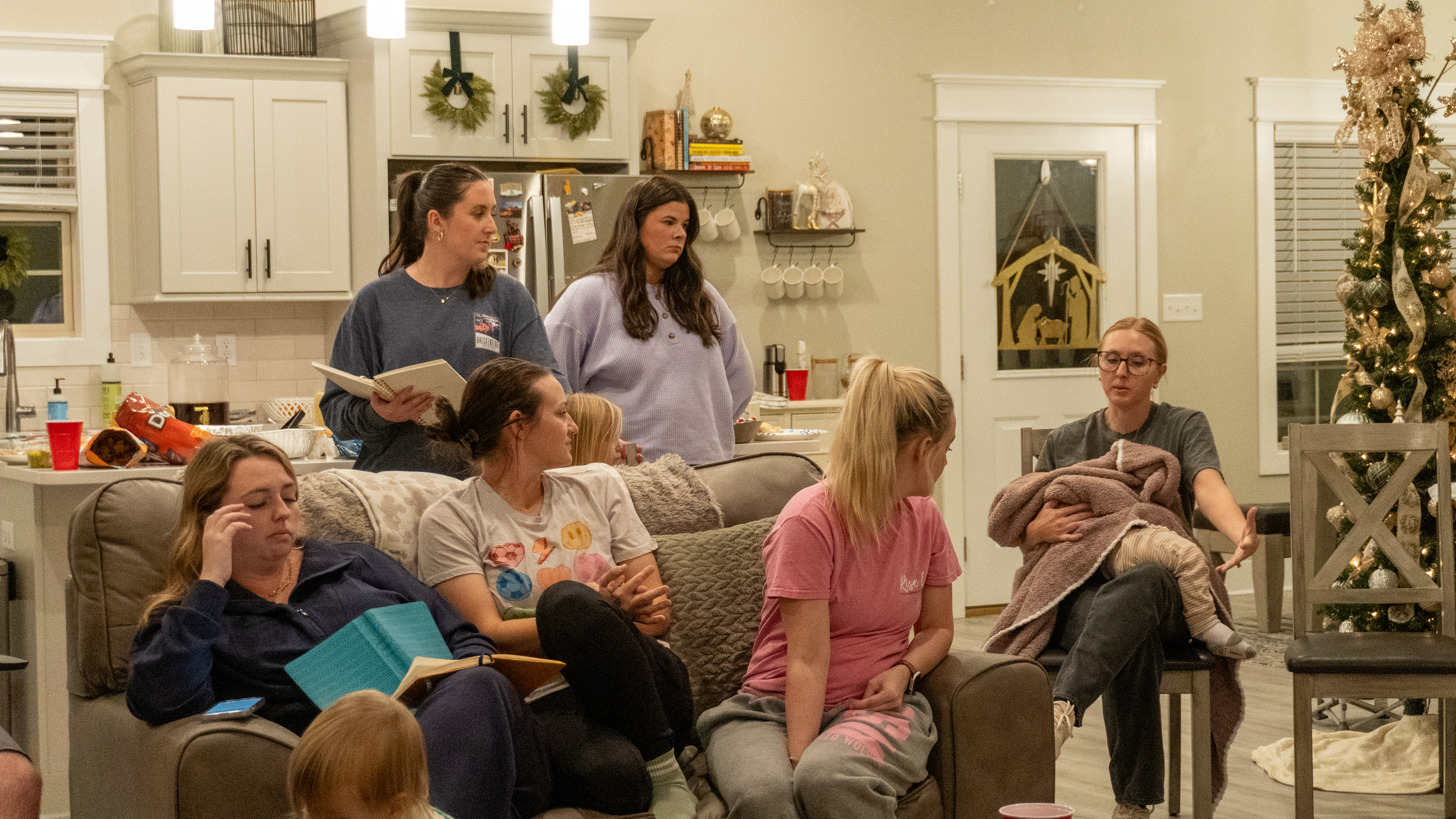 Group of Garner/Patterson women listen to Destiny McGee (far right) share her testimony.